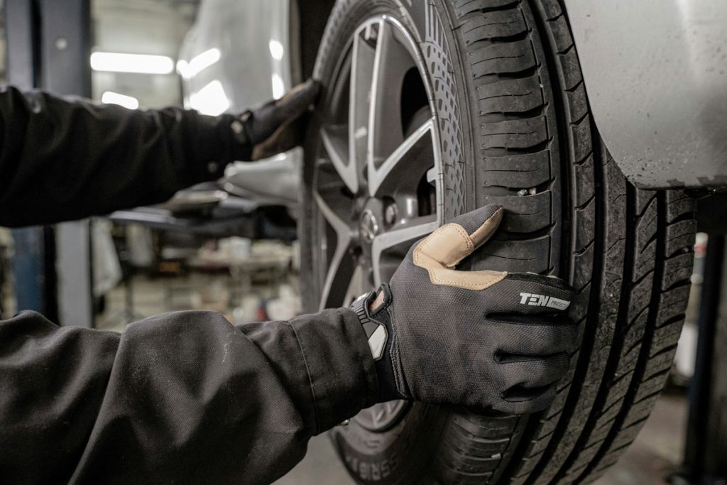 Mechanic checking tires