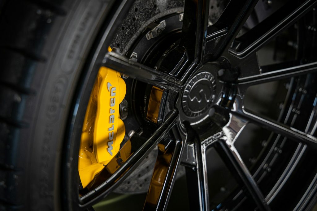 A closeup of a wheel on a McLaren 720s