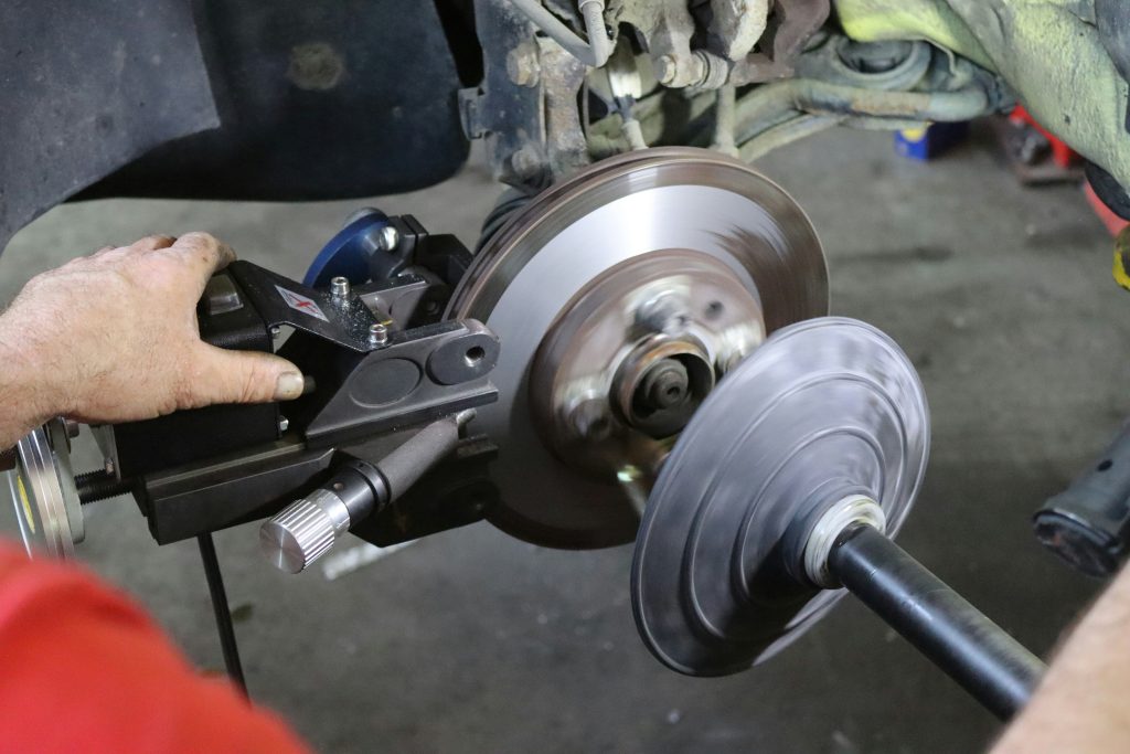 Man fixing a brake rotor